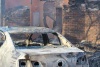 Vehicles reduced to ashes. Photo credit Helivac/Tromar