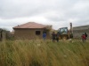 Bulldozer beginning demolition of house in Lenasia