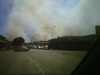 Smoke can be seen from inside of town.