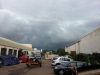 Storm clouds loom overhead.