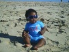 Cool eight months old baby at the beach