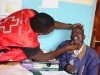 A surgical officer from HCFT  NGO examining a patient with cleft lips  before sending him for correctional surgery at the Mwingi general hospital (Fridah Mutune, News24 user)