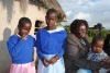 Joyce Chepkemoi with her 3 children. Her face was burnt in a boiling water during the skirmishes of 2007/08 but despite of all that,  she forgave those who disfigured her face and now all she wants is help to have facia plastic surgery in the USA. (Steve Wambugu, News24 user)