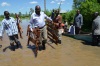 Kisumu Governor, Jack Ranguma helping flood victims transport household goods across the flooded Ombaka, Nyando, in Kisumu County (Oduor Omondi, News24 user)