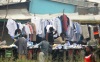 Men buying second hand clothes (mutumba) at a stall in Nairobi. (Dennis Omido, News24)