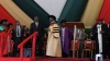 Dedan Kimathi University of Science and Technology senior staff dressing former President Kibaki with a gown when he was receiving a Honorary Doctorate Degree in Humane Letters (Litterarum Humanorum Doctor). Kibaki said education is one of the fastest ways to eradicate poverty. (Wangui Joseph, News24 user)