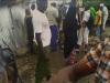 An AP police looks on as his staff members participate in the cleaning of Mombasa town. (Rodgers Buluma, News24 user)