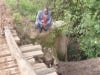Laikipia Governor Joshua Irungu Wakahora examines a risky wooden bridge at Nturukuma village in Laikipia. The bridge posses great danger to the area residents. He immediately called a road engineer so as to set up a new strong bridge. (James Kabotia, News24 user)