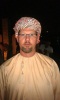In traditional Omani garb, Oman
