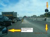 Light now green but a motorist runs the red light.  See side mirror image.