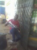 DSC_00363- A nother kenyan of the shop verandahs of kericho town follows the election results clsoely in the newspapers..JPG