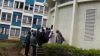 People trying to jostle inside the county chambers to witness the swearing in of their  governor.