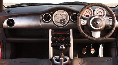The new dashboard, with both revcounter and speedo now in front of the driver. A lidded glovebox is optional