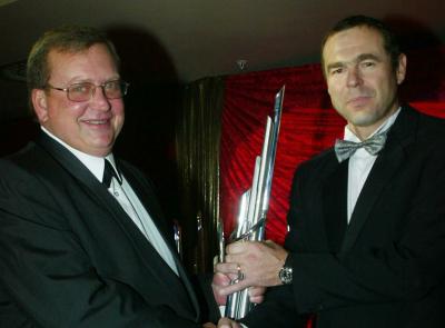 Glynn Hall (right) receives his trophy from MSA's Piet Swanepoel