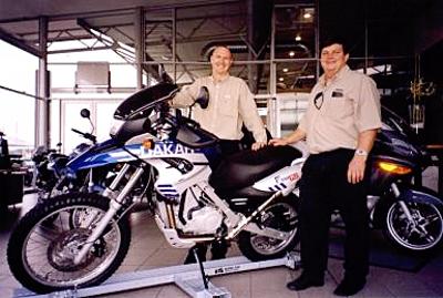 Rupert Culwick (right) and Colin Gallop from Motorrad Executive Rentals with one of the BMW motorcycles now available for rental to the public.
