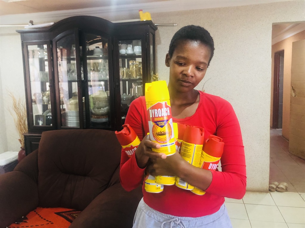 Sandisiwe Ntumbu holding insects’ killer because of the overwhelming flies they have. Photo by Sylvester Sibiya