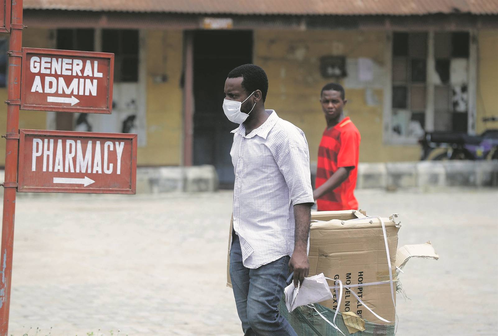 A man wears a face mask at the Mainland Hospital in Yaba, Lagos, Nigeria, where a person infected with the coronavirus is being treated. Health authorities reported the country’s first case on Friday. Picture: Sunday Alamba / AP