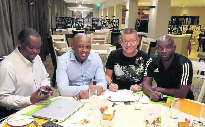 Ratshibvumo Mulovhedzi (right) with Jozef Vukusic, Lunga Sokhela and Qedi Dlamini after they concluded the coach’s deal at AmaZulu last year.