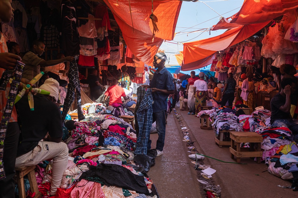 A secondhand clothes market in Kampala, in October 2023. (Photo by BADRU KATUMBA / AFP)