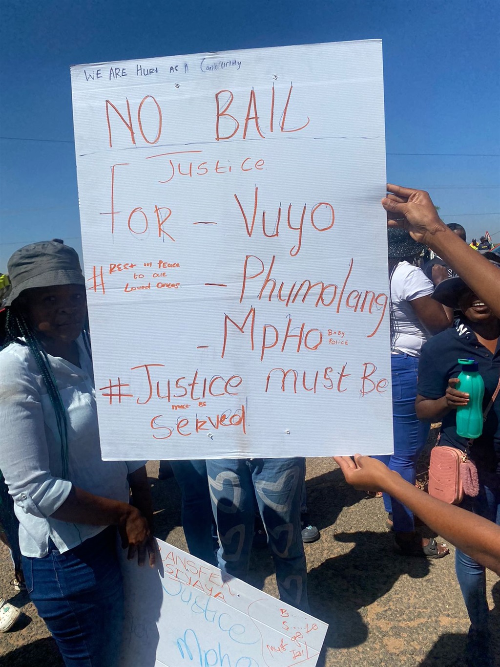 Residents demonstrate outside the court and demand no bail for suspects. Photo by Keletso Mkhwanazi