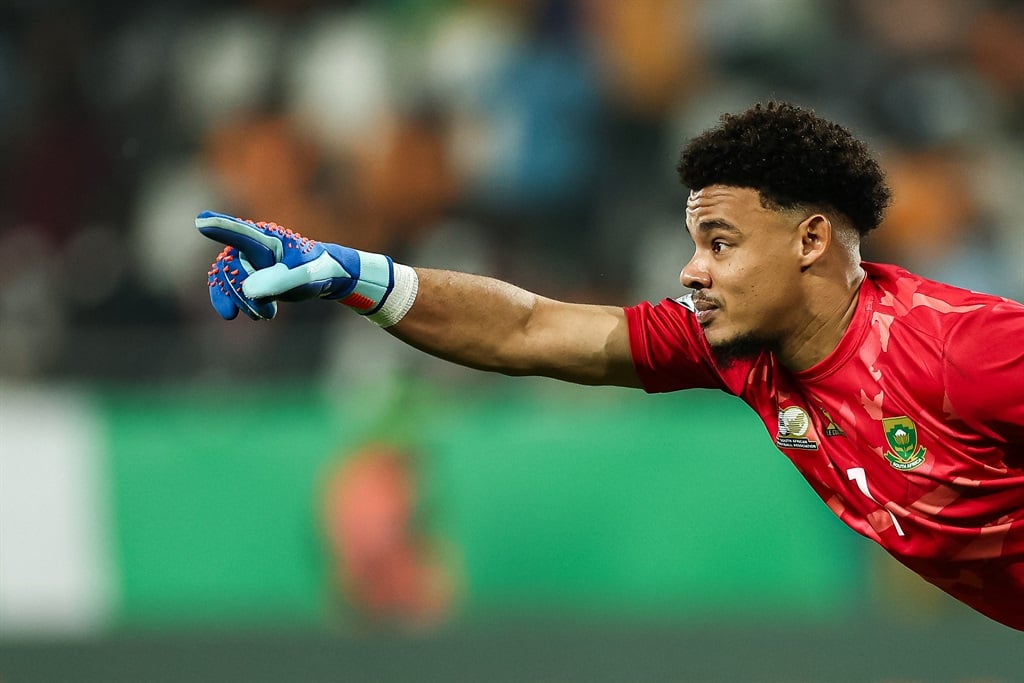 South Africa's goalkeeper #1 Ronwen Williams celebrates after winning at the end of the Africa Cup of Nations (CAN) 2024 quarter-final football match between Cape Verde and South Africa at the Stade Charles Konan Banny in Yamoussoukro on 3 February 2024.
