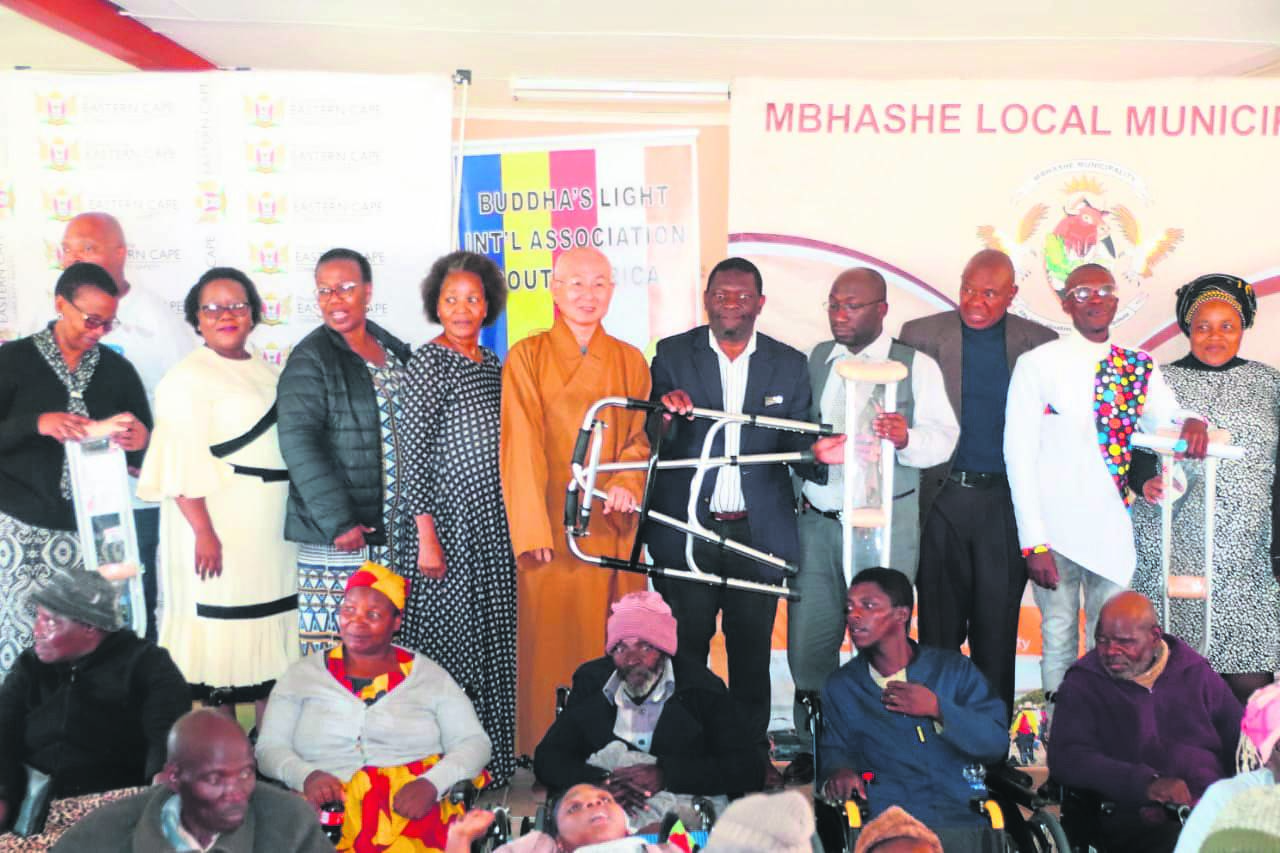 Officials from the Buddha's Light International Association, Mbhashe Local Municipality and various non-governmental organisations, pose for a photo with some of the beneficiaries who received mobility aids donated by the Taiwanese humanitarian organisation.    