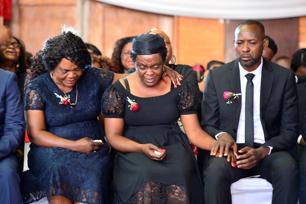 Enock Mpianzi's aunt Jeanine Kodiemoka comforts his parents Antonoitte and Guy Mpianzi at his funeral service at Kensington Secondary School on 1 February, 2020 in Johannesburg.