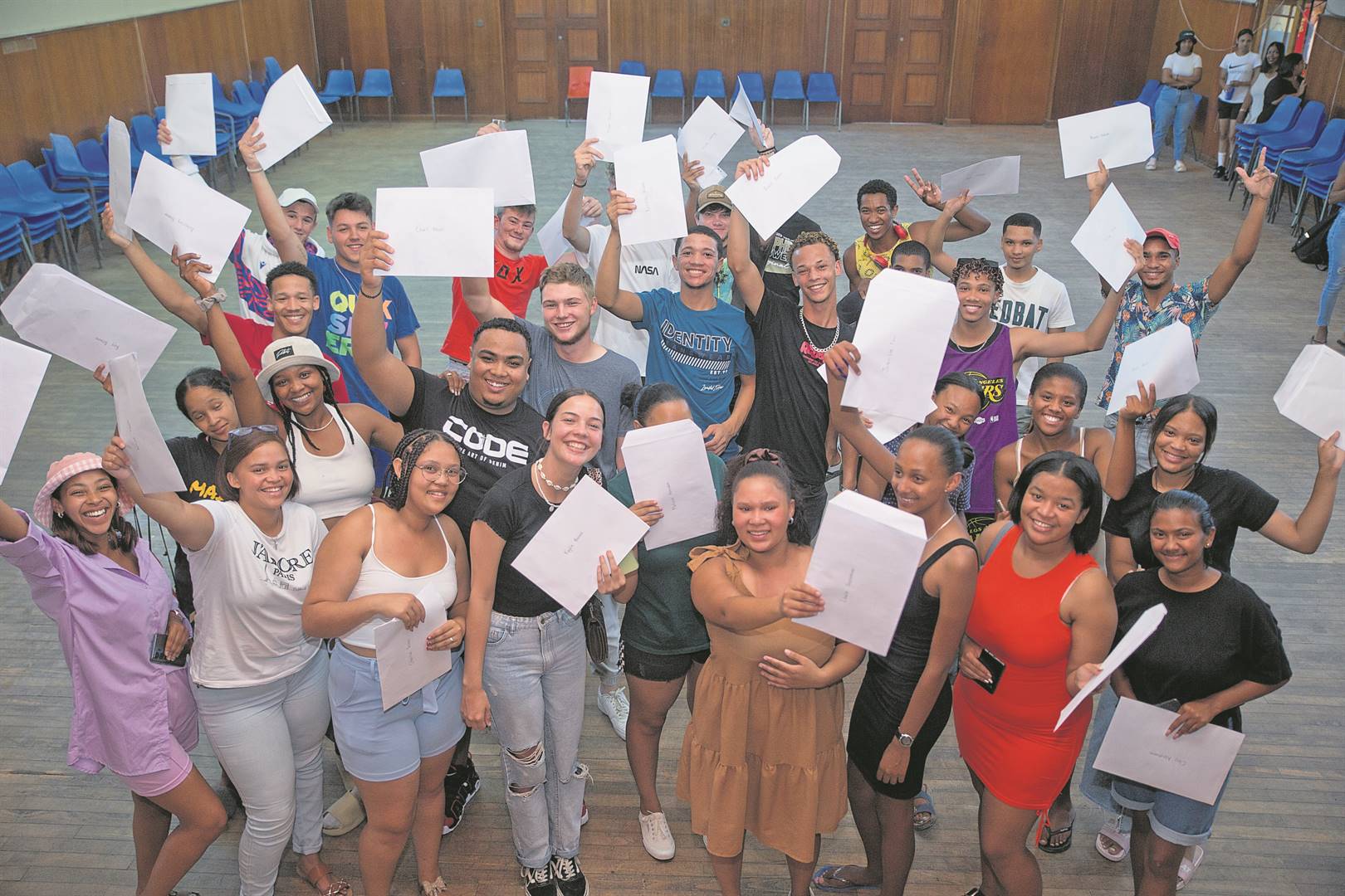 Matric students celebrate their results. All parents should have the choice on where to educate their children