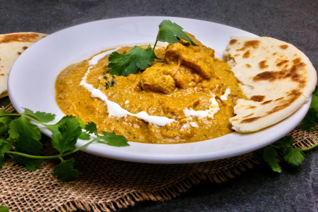 Butter chicken with naan. (File photo by Creative Touch Imaging Ltd./NurPhoto via Getty Images)