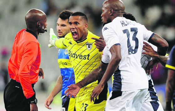 Bidvest Wits goalkeeper Ricardo Goss leads a protest against referee Masixole Bambiso