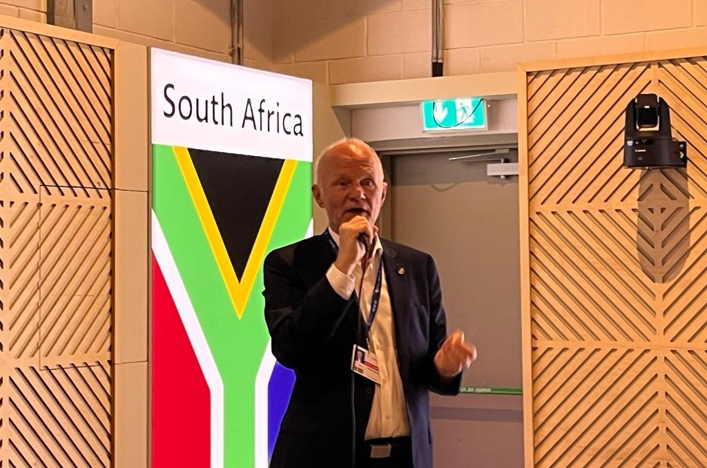 Germany's special envoy for the Just Energy Transition Partnership, Rainer Baake addresses COP28 delegates at the SA pavilion.