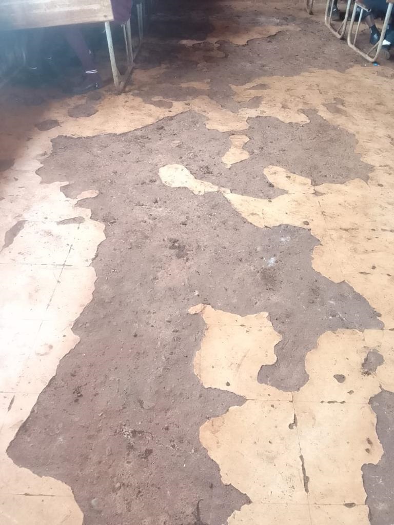  The old dusty floors inside the classroom. Photo 