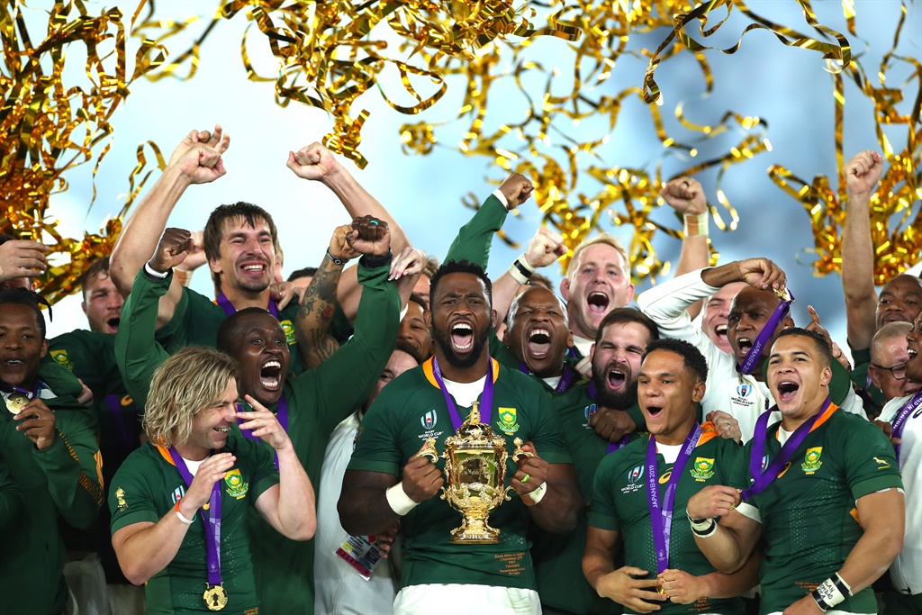 Players of South Africa celebrate as Siya Kolisi of South Africa lifts the Web Ellis Cup following their victory against England in the Rugby World Cup 2019 Final between England and South Africa at International Stadium Yokohama in Japan. (Photo by Cameron Spencer)