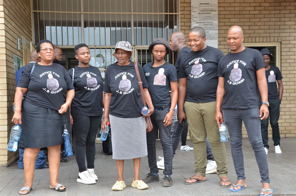 Relatives of Gumbi were joined by friends outside 