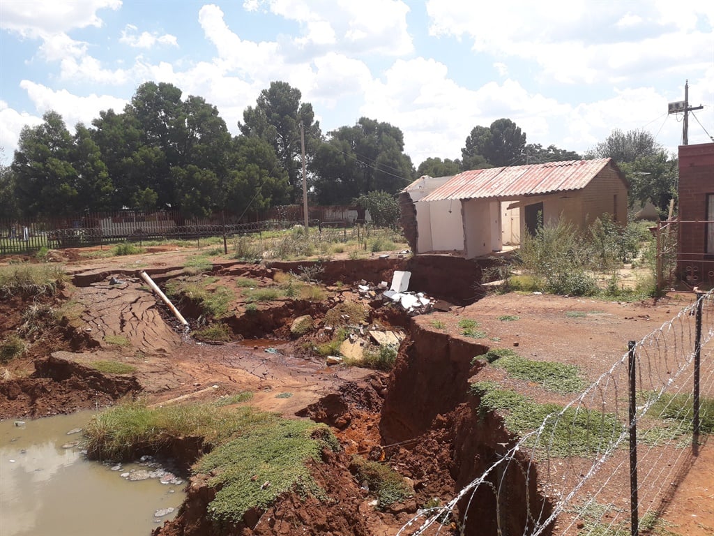 A sinkhole that has swallowed parts of a house in Khutsong.