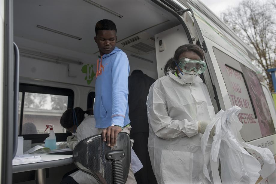 Medical workers prepare to test a person for Covid-19 in a mobile testing unit in Yeoville, Johannesburg. Picture: Shiraaz Mohamed/AP