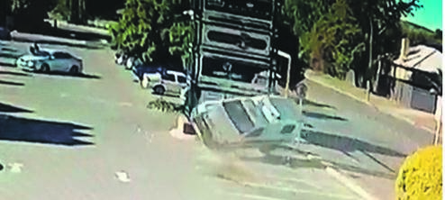 In this screengrab, the police vehicle can be seen rolling as it hits the two people.