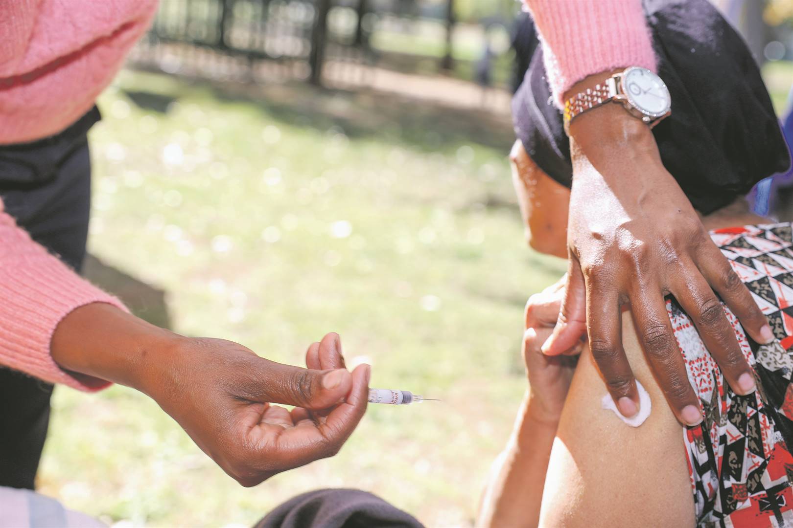 Citizens receive the flu vaccine, which is available at various public healthcare facilities across the country