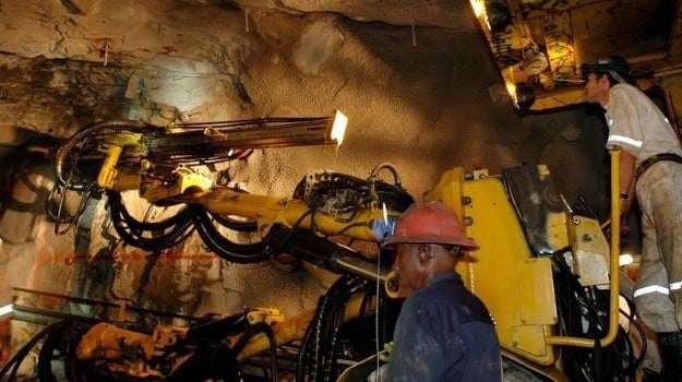 File photo: Workers underground at AngloGold Ashanti.