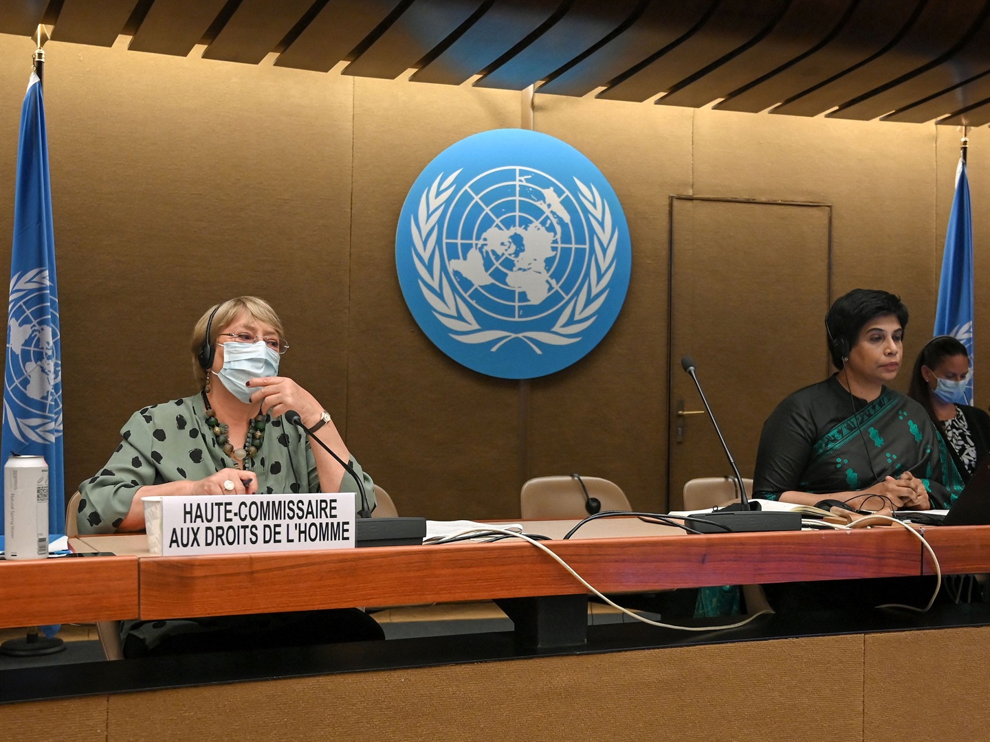 United Nations human rights chief Michelle Bachelet (L) sits next to Human Rights Council president Ambassador Nazhat Shameem Khan (R) after delivering a speech during a session of the Human Rights Council in Geneva.
