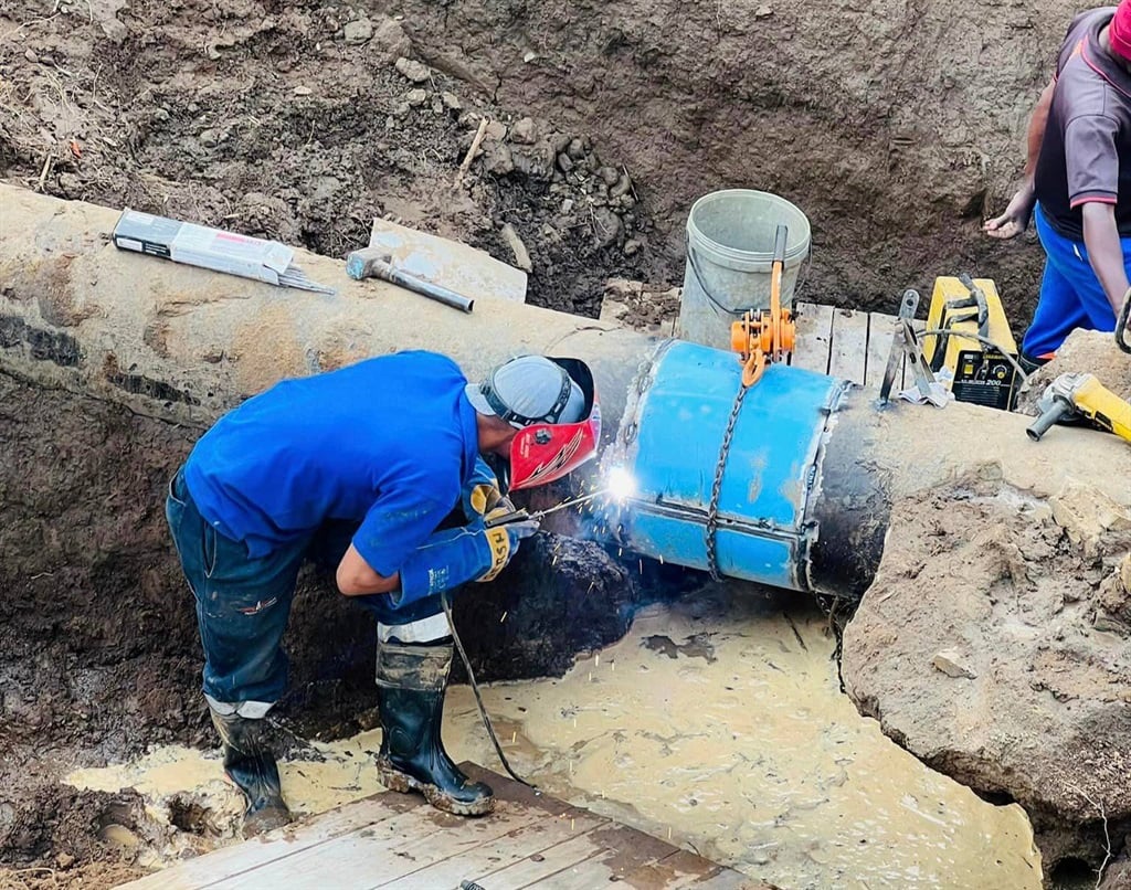 A municipal employee working on a pipeline in Ugu District earlier this year.