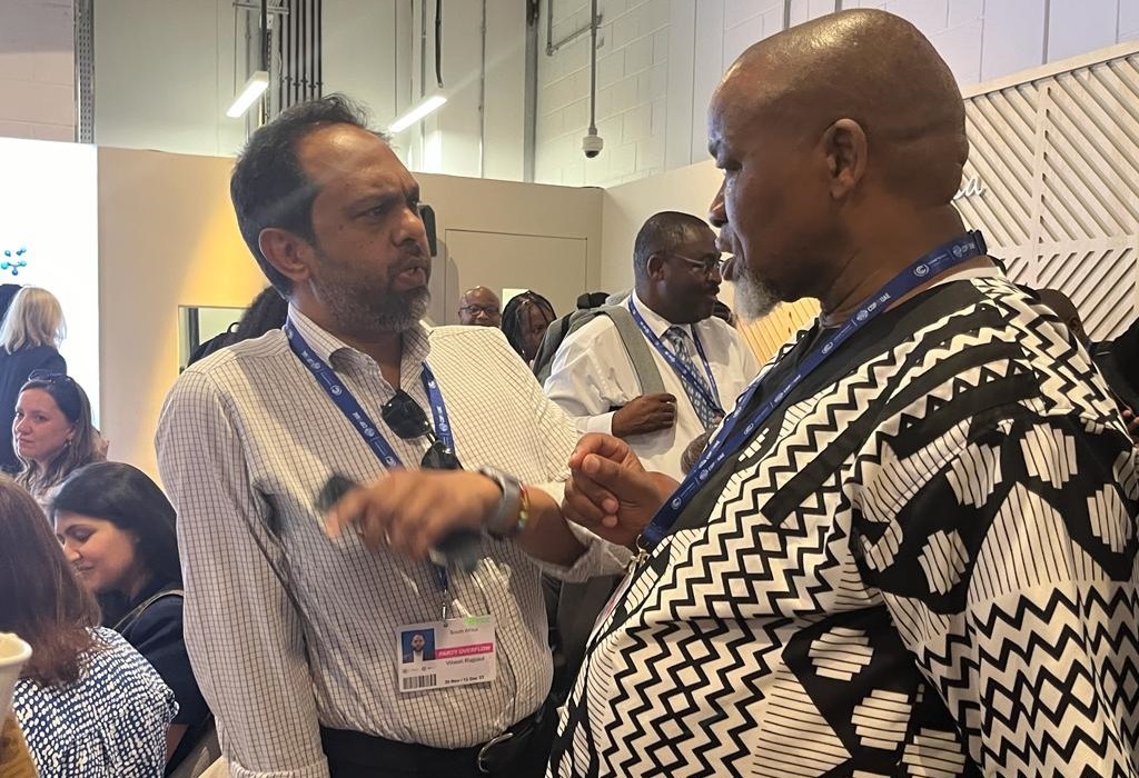 Eskom's Vikesh Rajpaul and Mineral Resources and Energy Minister Gwede Mantashe share a word after the minister's public criticism of the Komati decommissioning at COP28.