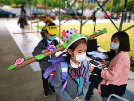 adorable children each wearing a surgical mask as 