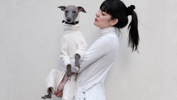 Three-year-old Lloyd has a warm, fashionable outfit to match his owner's, Paz Castro. Picture by Caters News