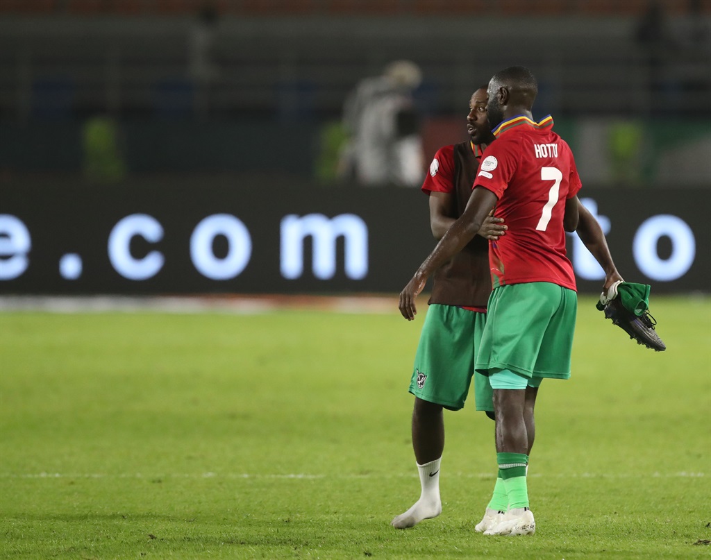 KORHOGO, IVORY COAST - JANUARY 16: Deon Hotto and Petrus Shitembi of Namibia embrace after the TotalEnergies CAF Africa Cup of Nations group stage match between Tunisia and Namibia at Amadou Gon Coulibaly Stadium on January 16, 2024 in Korhogo, Ivory Coast. (Photo by MB Media/Getty Images)