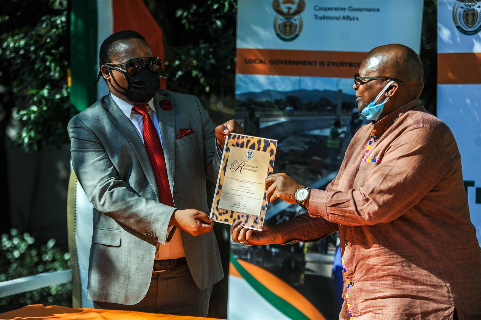 Cogta deputy minister Oupa Bapela hands over the signed certificate to the new king. Picture: Rosetta Msimango/City Press