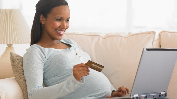 Single mother doing online banking (PHOTO: Getty Images)