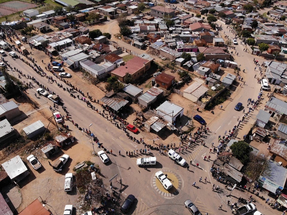 An aerial view shows residents of the Olievenhoutb