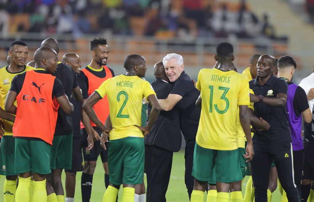Bafana head coach Hugo Broos celebrates with his players after South Africa picked up a crucial point against Tunisia en route to the last 16 round of Afcon in the Ivory Coast on Wednesday night. 