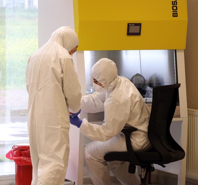 Lab employees perform testing on samples for coronavirus at a Covid-19 diagnosis centre in Kocaeli, Turkey. Picture: Kadir Yildiz/Anadolu Agency via Getty Images